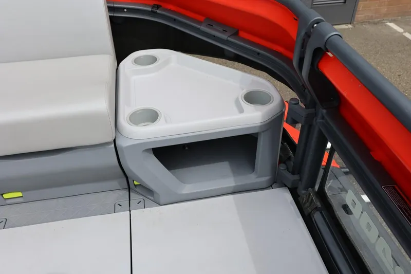 Slide: The Image of 2022 Sea-Doo Switch Cruise 21 interior with seating and cup holders. - 32