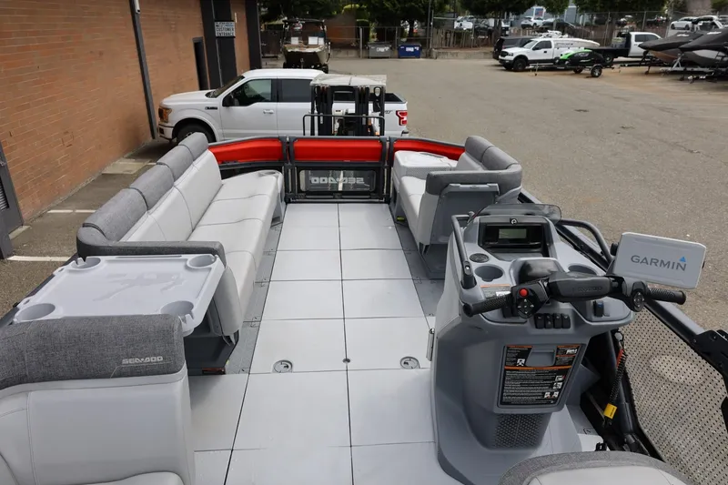 Slide: The Image of 2022 Sea-Doo Switch Cruise 21 interior with seating and Garmin navigation system. - 35