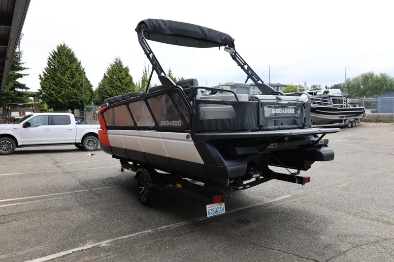 Slide: The Image of 2022 Sea-Doo Switch Cruise 21 on trailer in parking lot, rear view. - 9