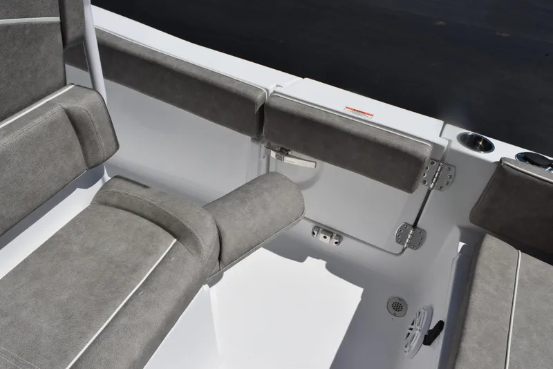 Slide: The Image of Interior seating of 2026 Sea Hunt Ultra 235 SE boat with gray upholstery. - 16