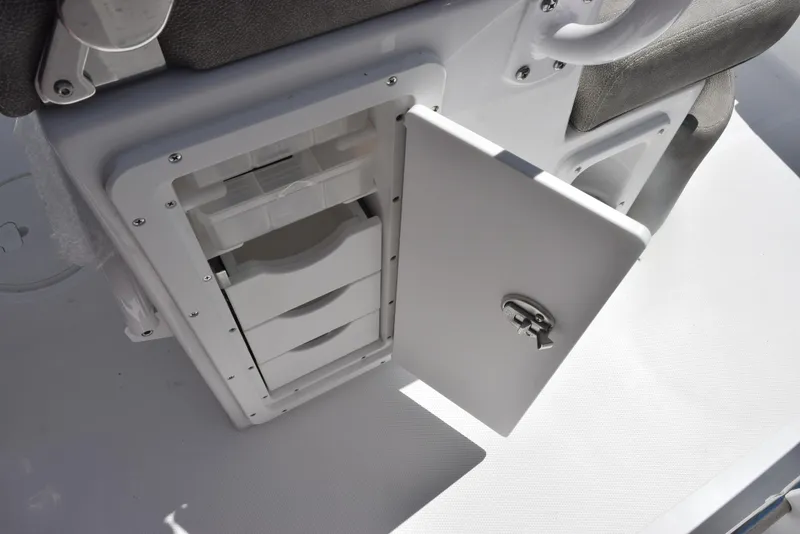 Slide: The Image of Open storage compartment on 2026 Sea Hunt Ultra 235 SE boat. - 20