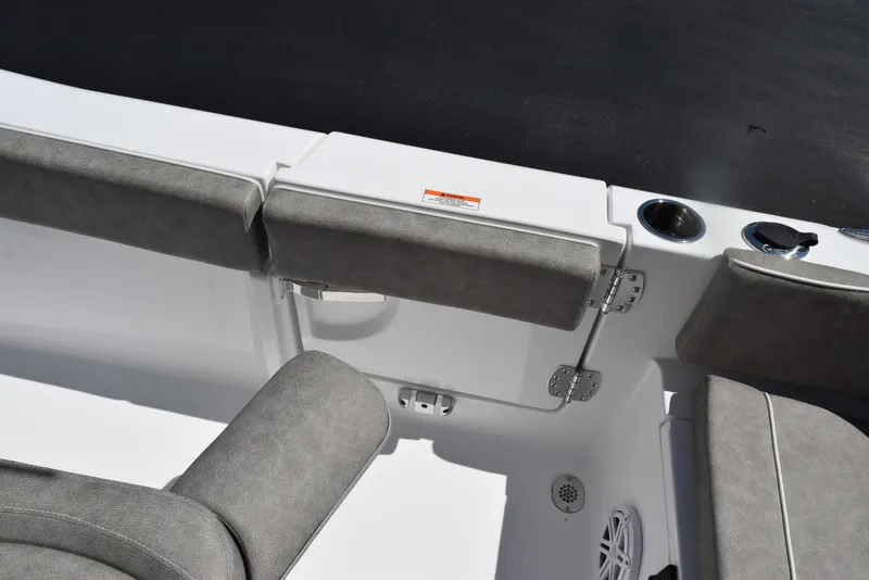 Slide: The Image of Interior seating of 2026 Sea Hunt Ultra 235 SE boat with gray cushions. - 22