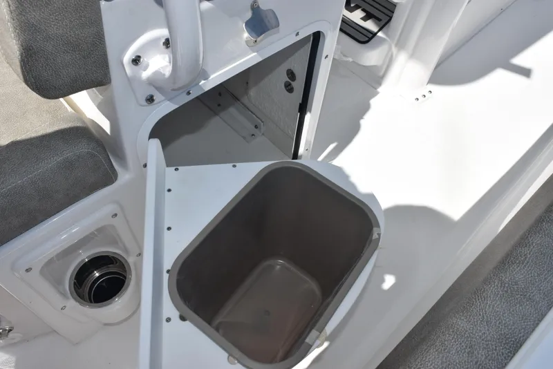Slide: The Image of Storage compartment on 2026 Sea Hunt Ultra 235 SE boat, featuring a built-in container. - 23