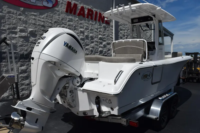 Slide: The Image of 2026 Sea Hunt Ultra 235 SE boat with Yamaha engine on a trailer. - 4