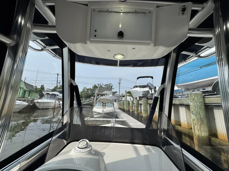 Slide: The Image of 2014 Sea Hunt Ultra 196 dashboard with Garmin display and Yamaha gauges. - 6