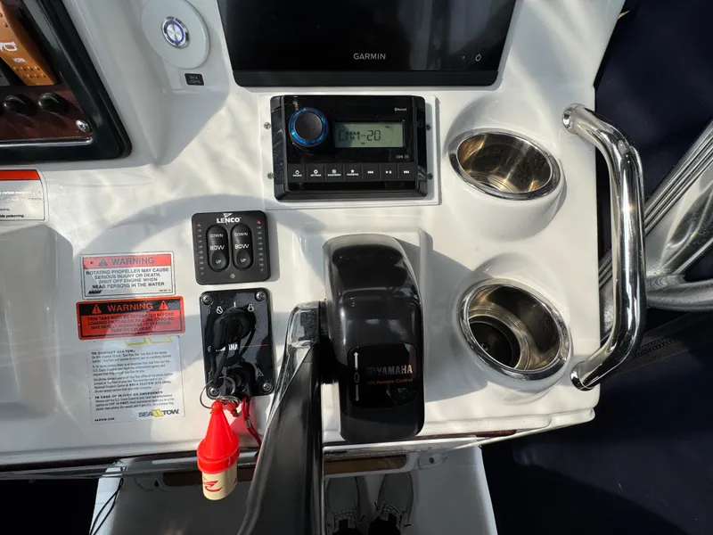 Slide: The Image of Steering wheel and controls of a 2014 Sea Hunt Ultra 196 boat. - 8