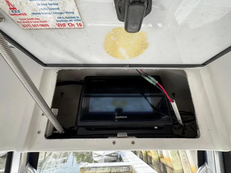 Slide: The Image of Control panel of a 2014 Sea Hunt Ultra 196 boat with Yamaha remote and cup holders. - 9