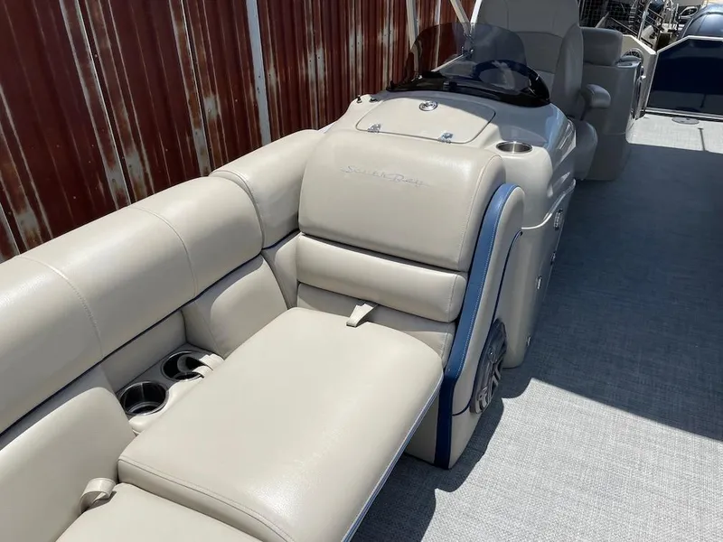 Slide: The Image of 2017 South Bay 500 boat interior with beige seating and cup holders. - 14