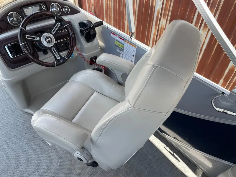 Slide: The Image of Captain's chair and dashboard of a 2017 South Bay 500 boat. - 8