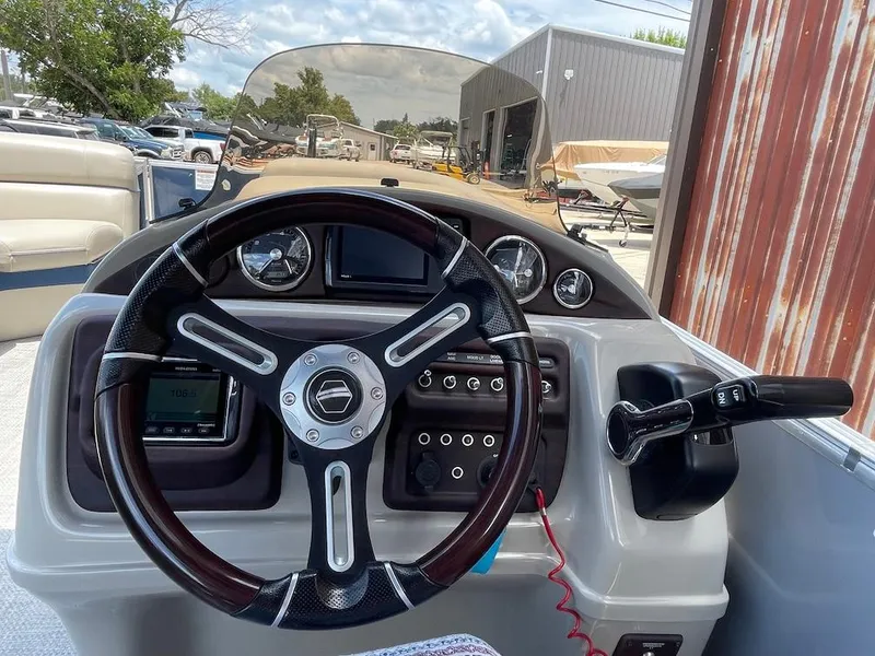 Slide: The Image of Steering console of a 2017 South Bay 500 boat with gauges and controls. - 9