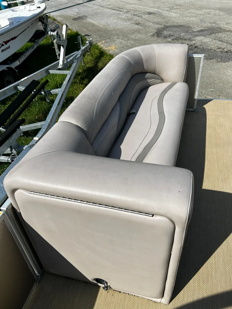 Slide: The Image of Gray leather seating on a 2015 Sweetwater Premium Edition 240 boat deck. - 5