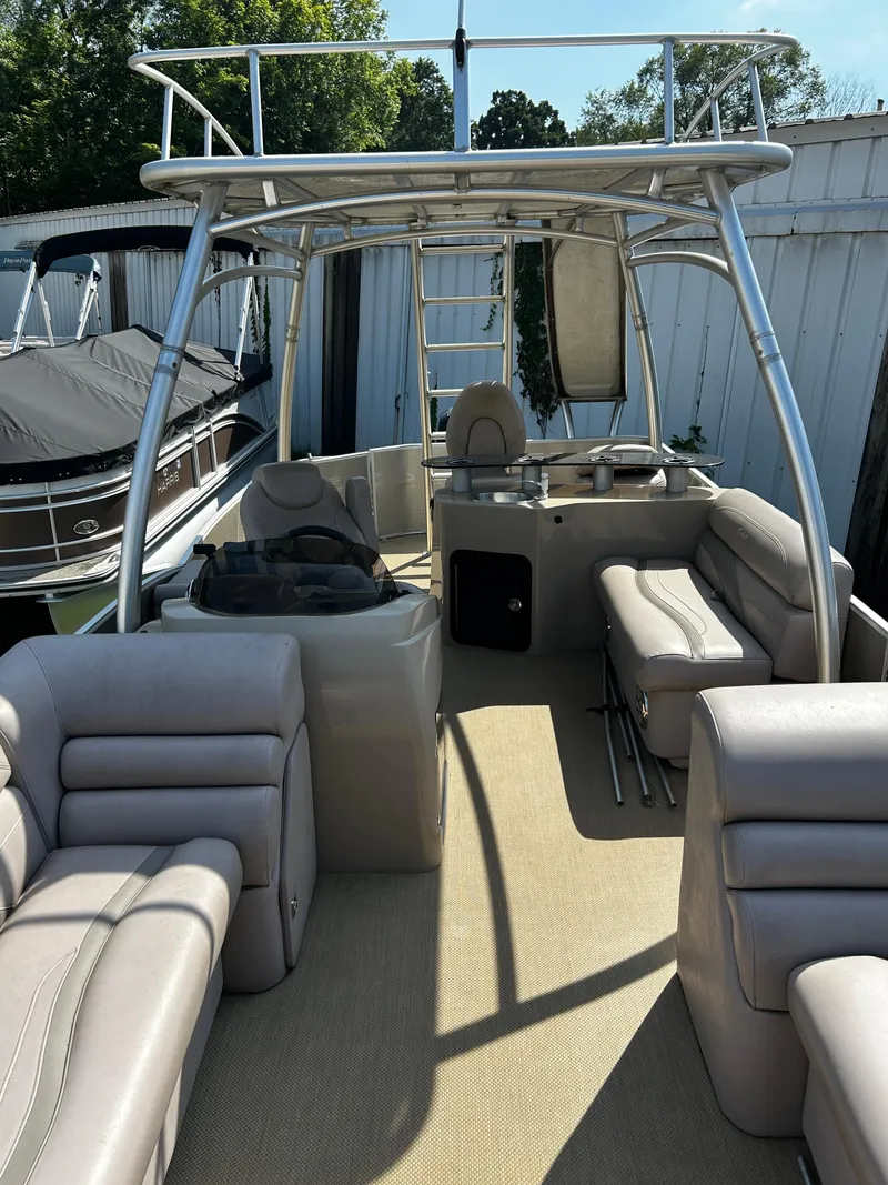 Slide: The Image of Sweetwater Premium Edition 240 boat interior with seating and helm, 2015 model. - 7