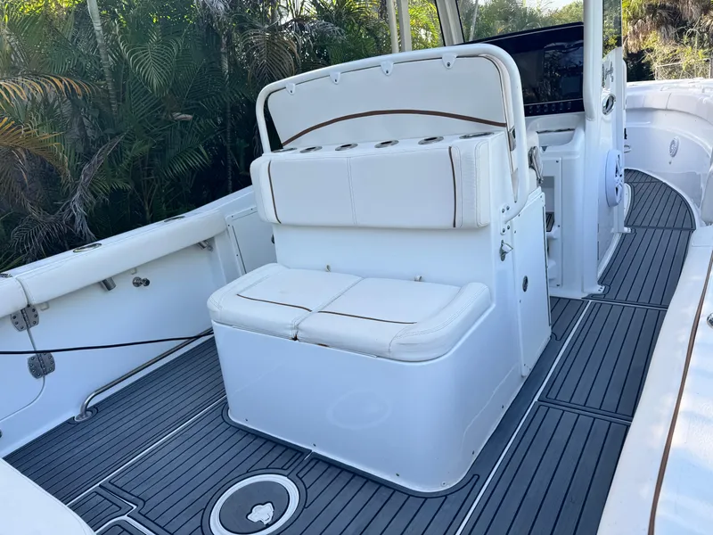 Slide: The Image of 2021 Sea Hunt Gamefish 30 Coffin Box interior with white seating and gray flooring. - 3