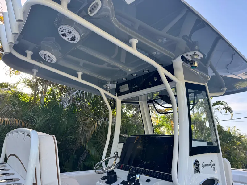 Slide: The Image of 2021 Sea Hunt Gamefish 30 Coffin Box boat console with canopy and electronics. - 9