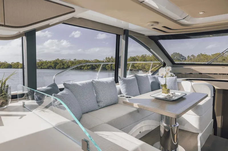 Slide: The Image of Luxurious interior of 2025 Cruisers Yachts 57 Fly with elegant seating and scenic views. - 30