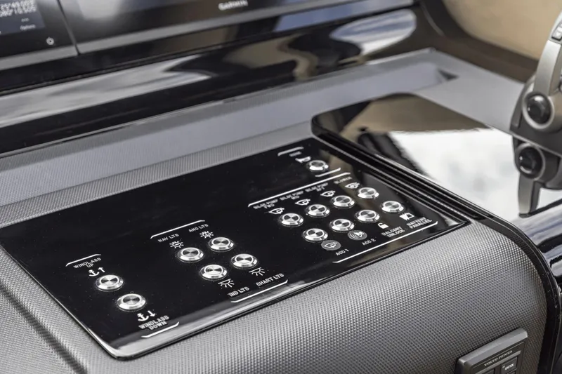 Slide: The Image of Control panel of 2025 Cruisers Yachts 57 Fly, featuring modern navigation and system controls. - 41