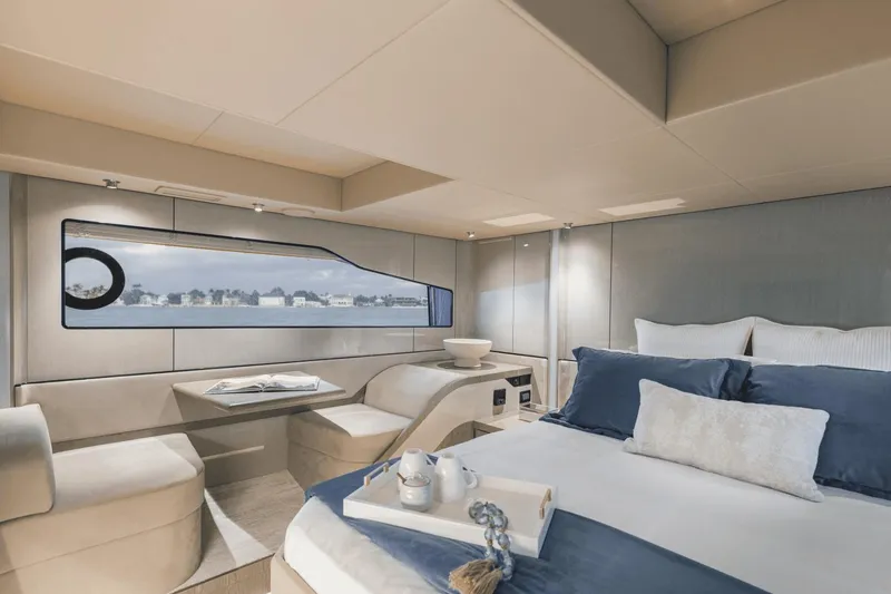 Slide: The Image of Luxurious interior of 2025 Cruisers Yachts 57 Fly, featuring elegant bedroom and seating area. - 44