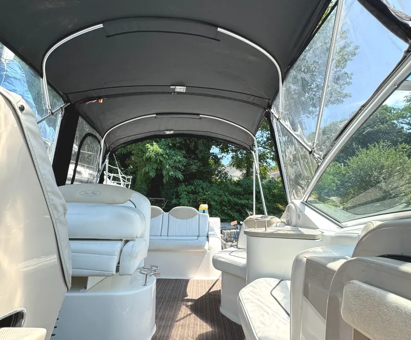 Slide: The Image of Interior view of 2008 Sea Ray 240 Sundancer boat with canopy and seating. - 10