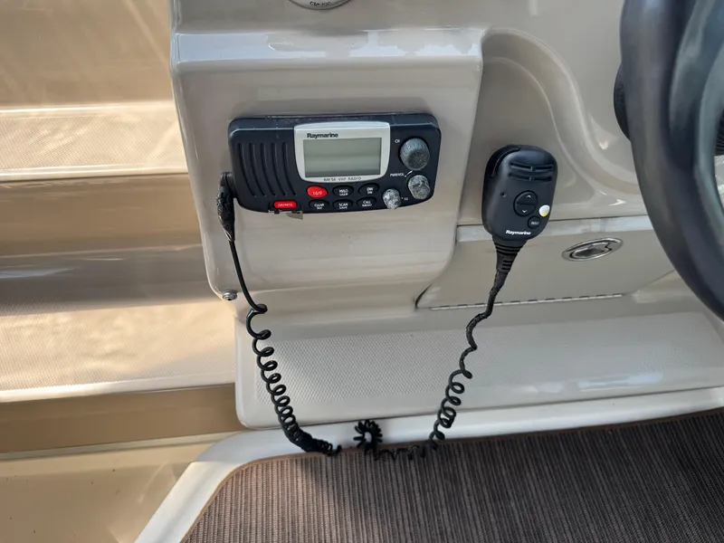 Slide: The Image of VHF radio system on 2008 Sea Ray 240 Sundancer boat dashboard. - 23