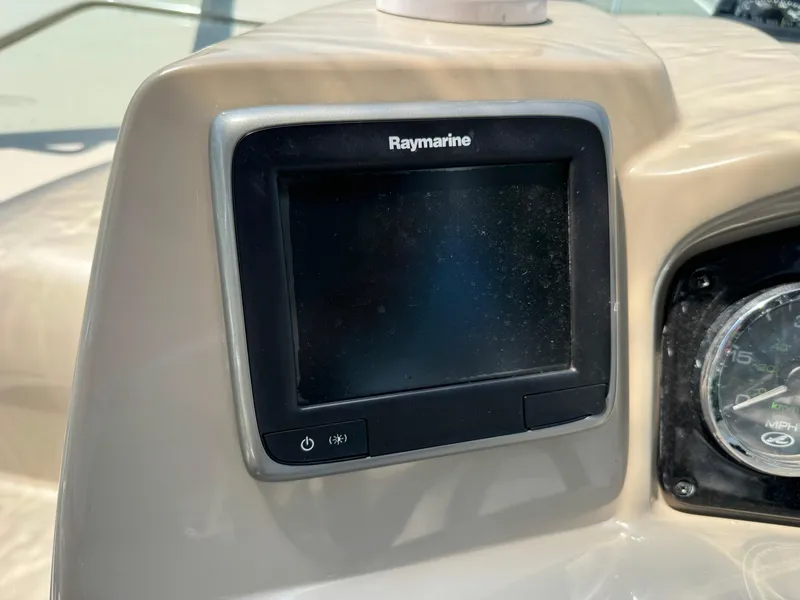 Slide: The Image of Raymarine display on 2008 Sea Ray 240 Sundancer dashboard. - 25