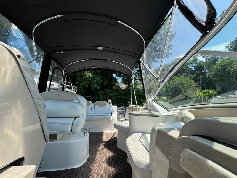 Slide: The Image of Interior view of 2008 Sea Ray 240 Sundancer boat with seating and canopy. - 4
