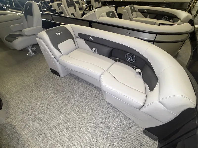 Slide: The Image of The image shows the interior of a 2026 Barletta Aria 22 QC with sleek, gray upholstered seating. - 4
