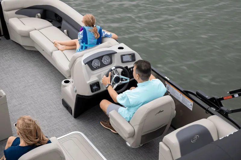 Slide: The Image of 2026 Barletta Aria 24 QC pontoon boat on the water. - 2