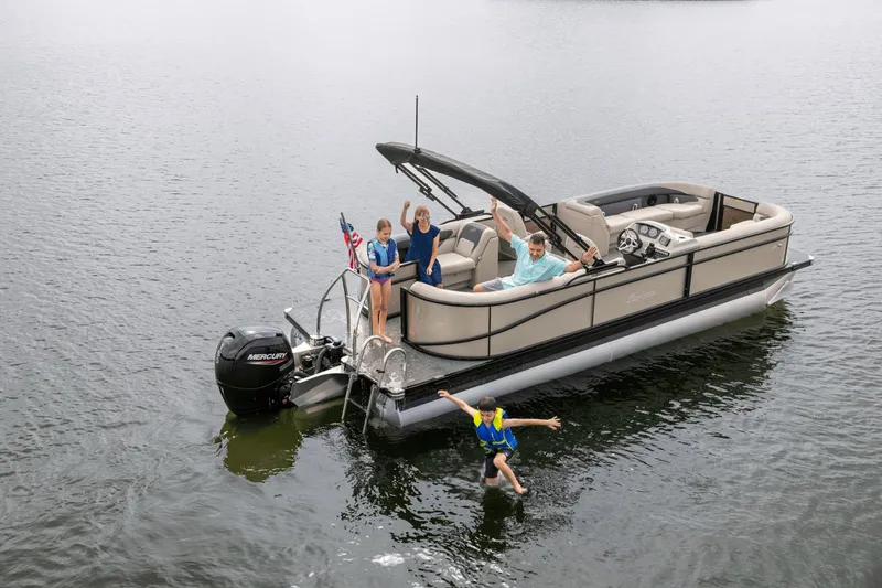 Slide: The Image of Family enjoying Barletta Aria 24 QC pontoon boat on the water. - 4