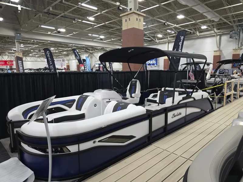 Slide: The Image of 2026 Barletta Corsa 23 U pontoon boat at a trade show. - 5