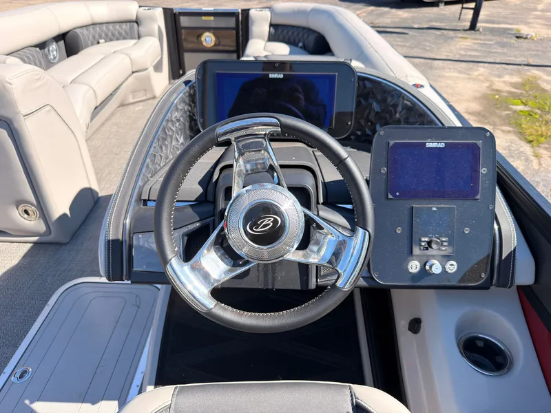 Slide: The Image of The image shows the cockpit of a 2026 Barletta Lusso 25 U with a sleek steering wheel and modern instruments. - 48