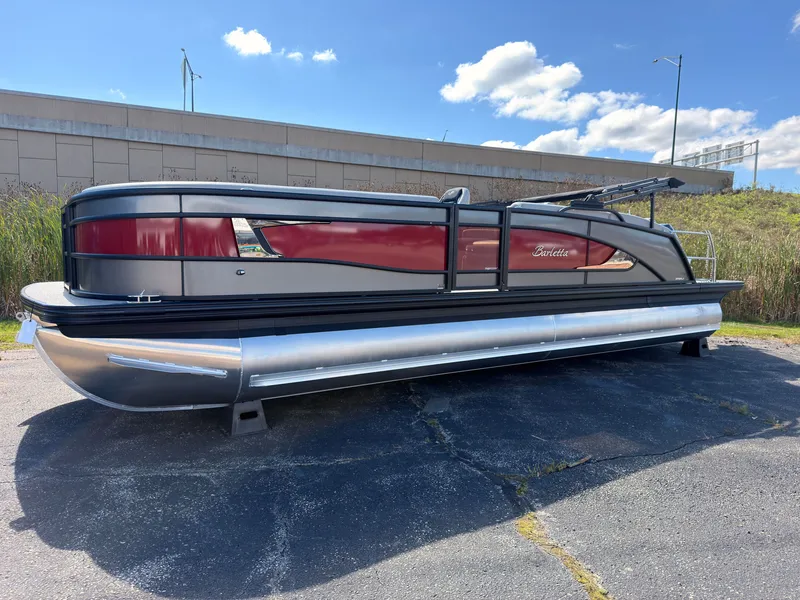 The Image of A sleek 2026 Barletta Lusso 25 U pontoon boat is parked on a lot. - 0