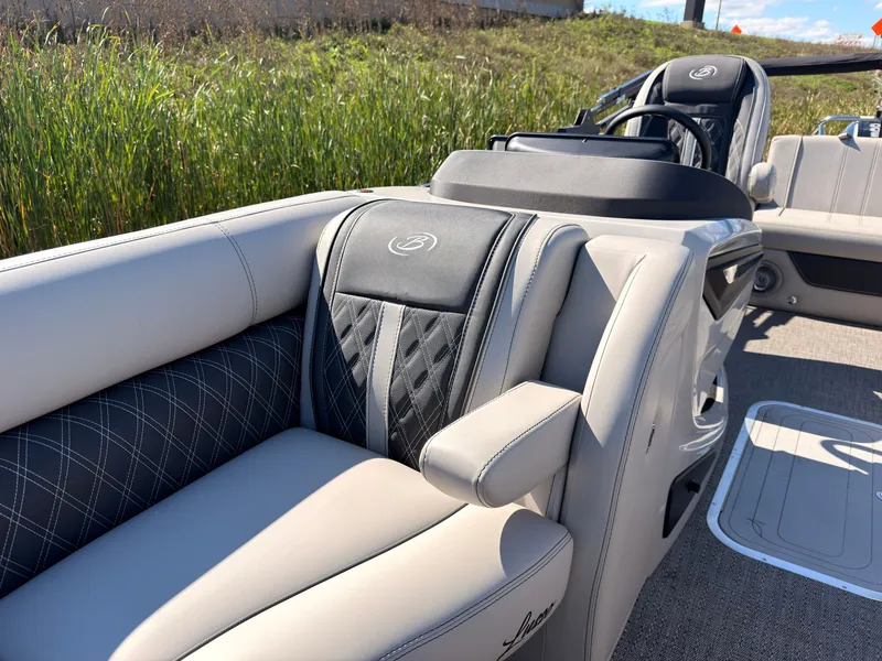 Slide: The Image of The image shows the luxurious interior of a 2026 Barletta Lusso 25 U with elegant seating. - 31