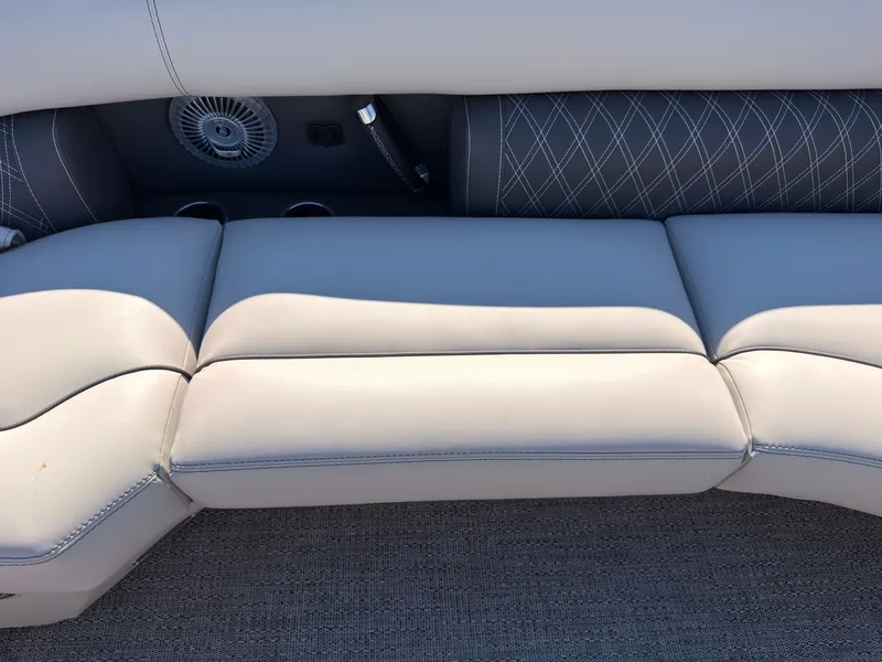 Slide: The Image of The image shows a luxurious, upholstered bench seat with gray fabric and a quilted pattern. - 26