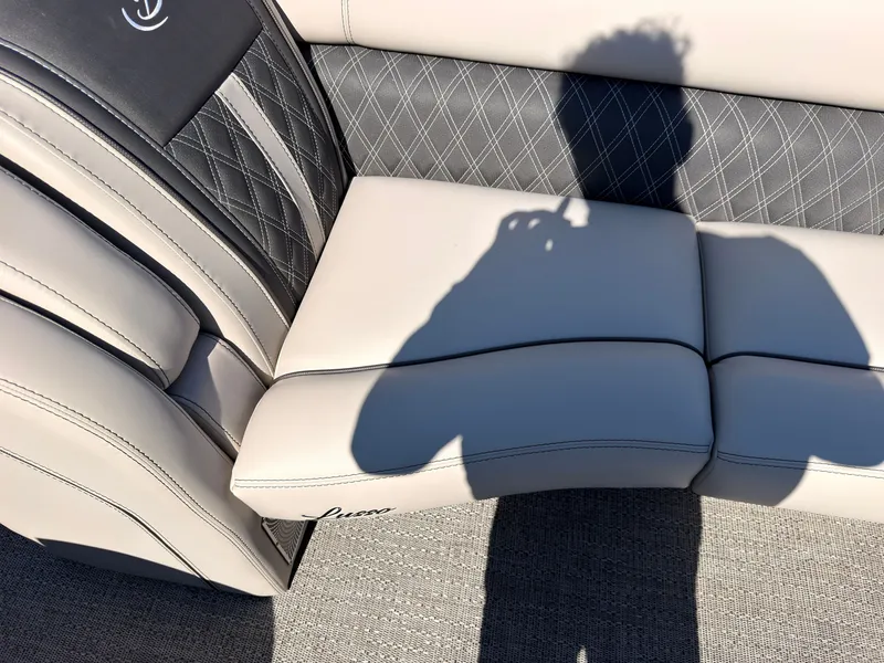Slide: The Image of Shadow on a sleek, upholstered seat with quilted pattern and "Lusso" branding. - 19