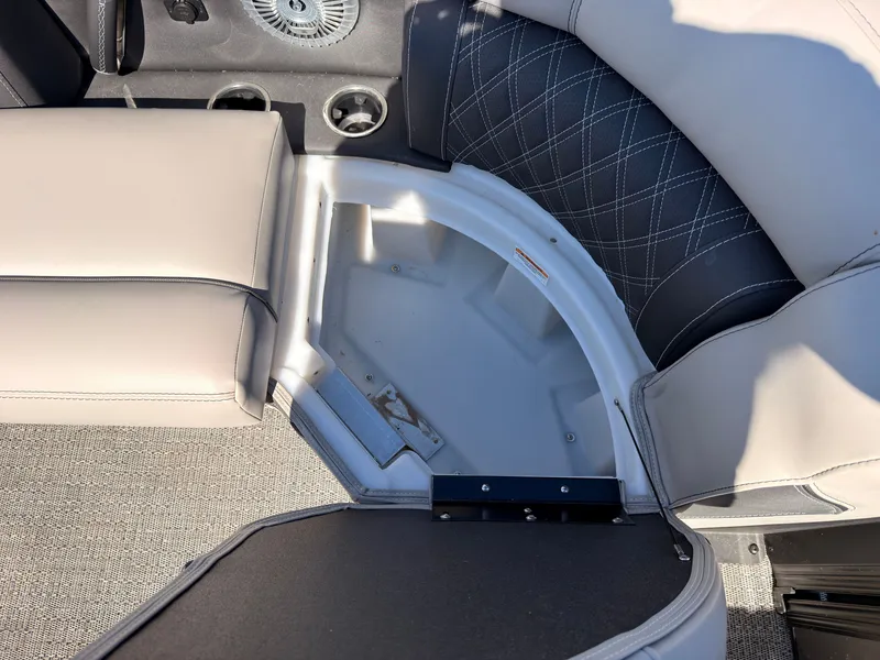 Slide: The Image of Close-up of a seating area with gray upholstery and carpet on a Barletta Lusso 25 U boat. - 16