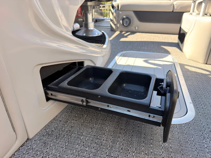 Slide: The Image of A pull-out compartment with two black containers on a boat. - 35