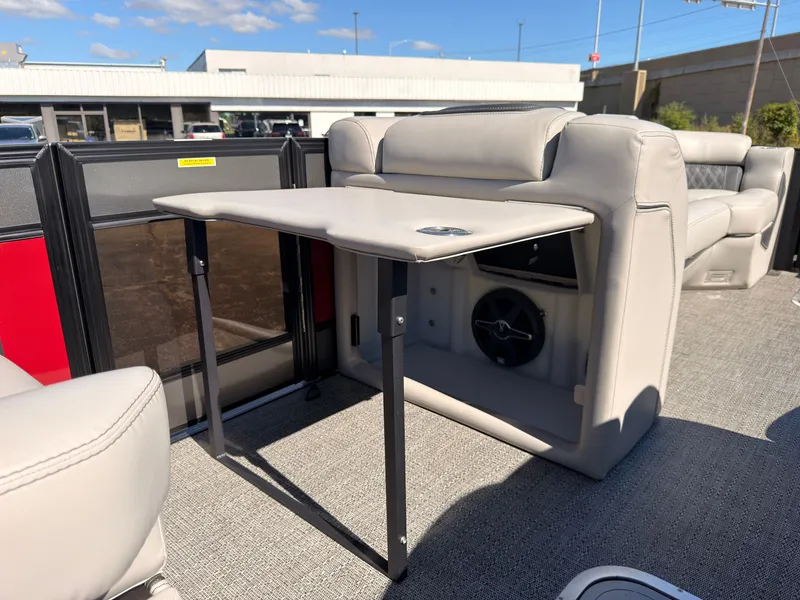Slide: The Image of The image shows the interior of a 2026 Barletta Lusso 25 U with a foldable table. - 40