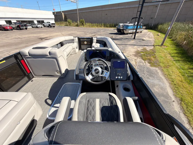 Slide: The Image of The image shows the cockpit of a 2026 Barletta Lusso 25 U with modern instruments and gray seating. - 47