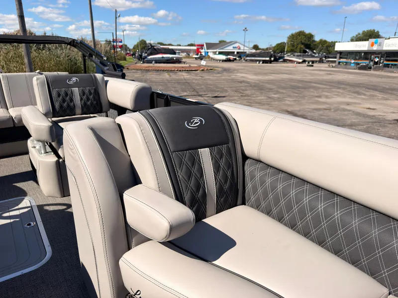 Slide: The Image of The 2026 Barletta Lusso 25 U features luxurious, upholstered seating with elegant stitching. - 22