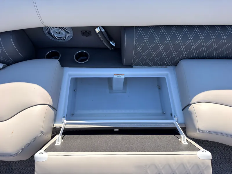 Slide: The Image of The image shows the interior of a 2026 Barletta Lusso 25 U with gray upholstery and storage space. - 27