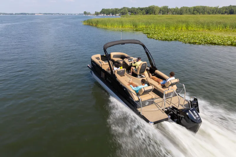 Slide: The Image of Barletta Cabrio 24 M 2026 cruising on a serene lake. - 4