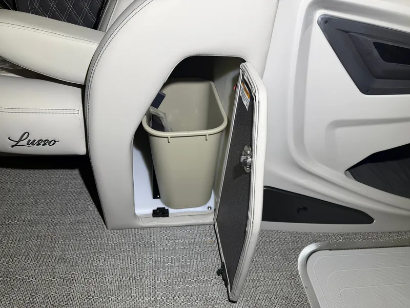 Slide: The Image of An open storage compartment with a trash bin inside a Barletta Lusso 23 QCSS boat. - 15