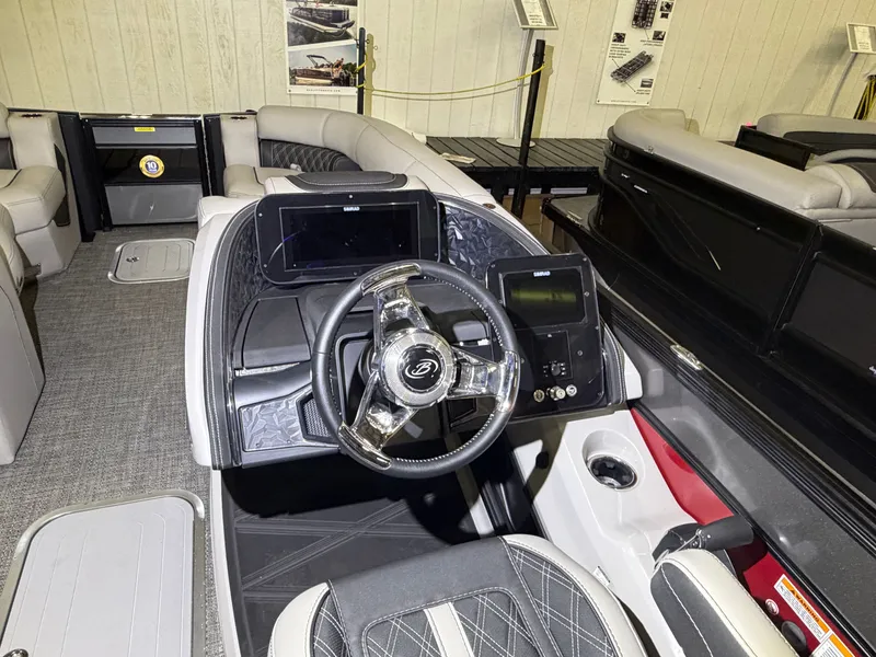 Slide: The Image of Interior view of a 2026 Barletta Lusso 23 QCSS with modern helm and luxurious seating. - 24