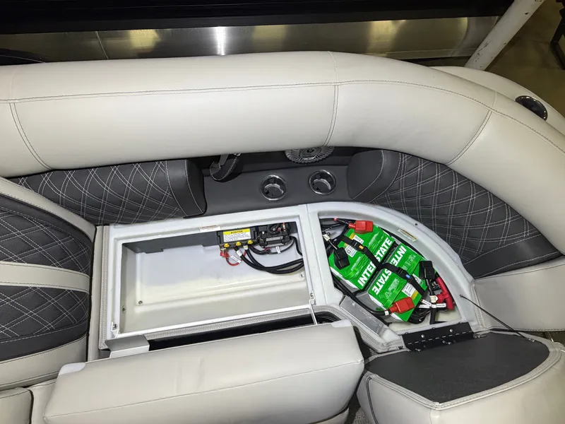 Slide: The Image of The image shows the interior of a Barletta Lusso 23 QCSS with an open storage compartment. - 34