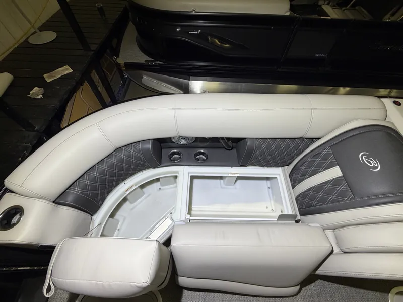 Slide: The Image of The image shows the luxurious interior of a Barletta Lusso 23 QCSS boat with elegant seating. - 10
