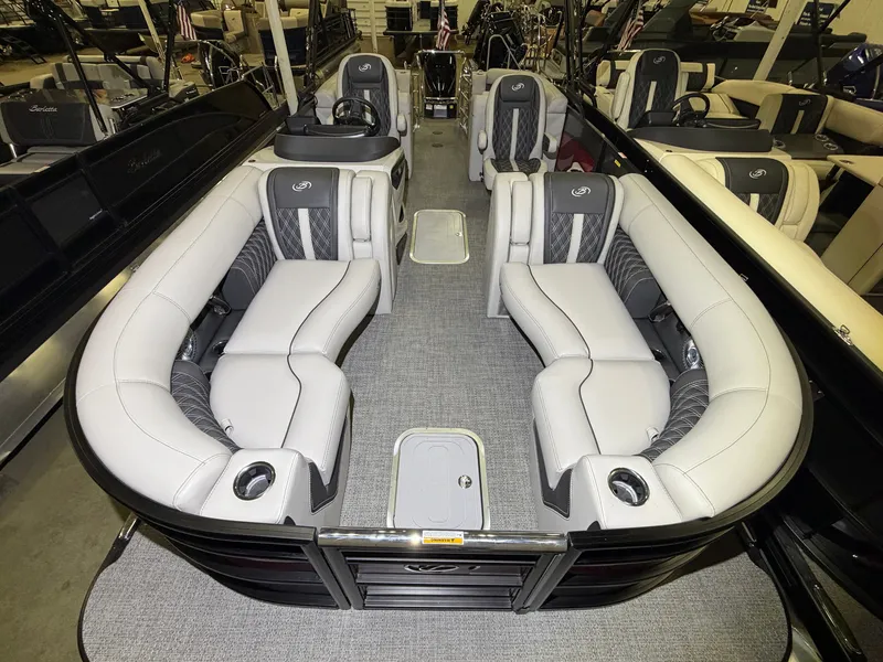 Slide: The Image of The image shows the interior of a Barletta Lusso 23 QCSS pontoon boat with luxurious seating. - 7