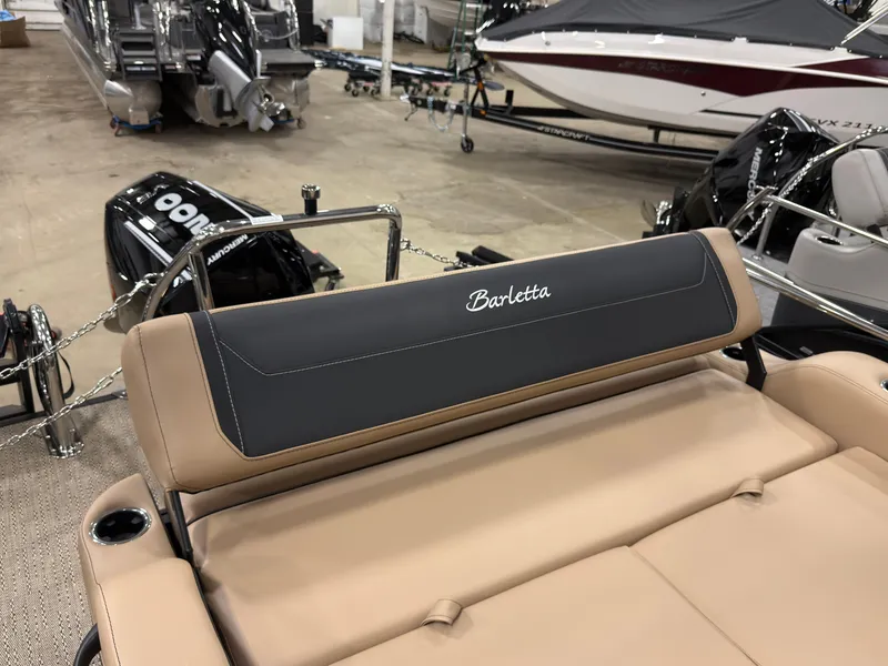 Slide: The Image of Barletta Cabrio 22 U 2026, luxurious boat seating in a showroom. - 23