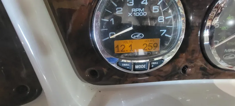 Slide: The Image of Close-up of 2004 Sea Ray 260 Sundancer dashboard showing RPM gauge and digital display. - 13