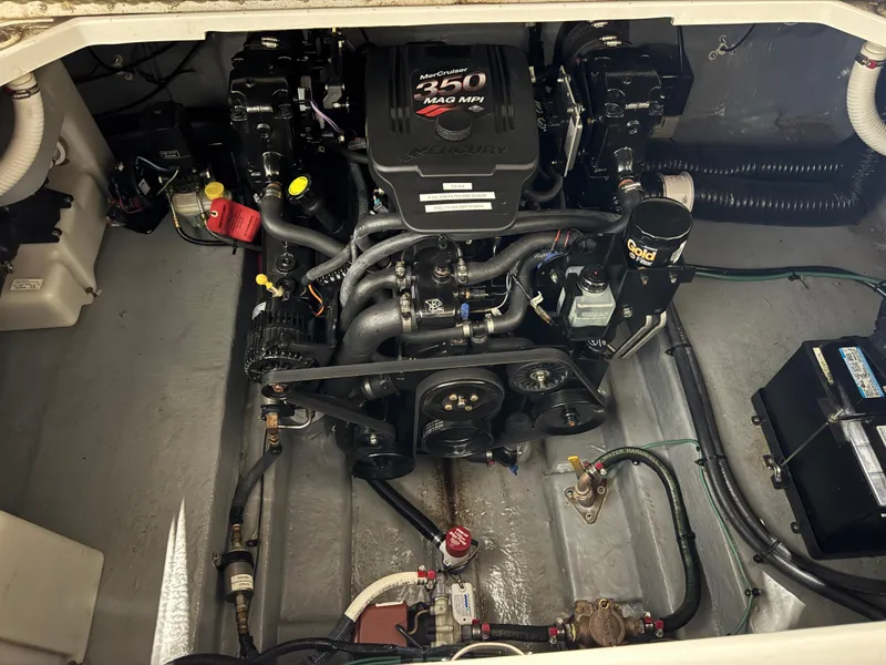 Slide: The Image of Engine compartment of a 2004 Sea Ray 260 Sundancer with MerCruiser 350 MAG MPI engine. - 23
