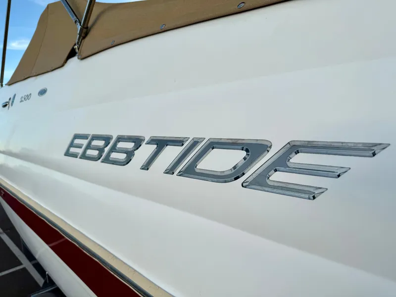 Slide: The Image of 2013 Ebbtide 2500 SS Fun Cruiser DC boat with logo detail. - 17